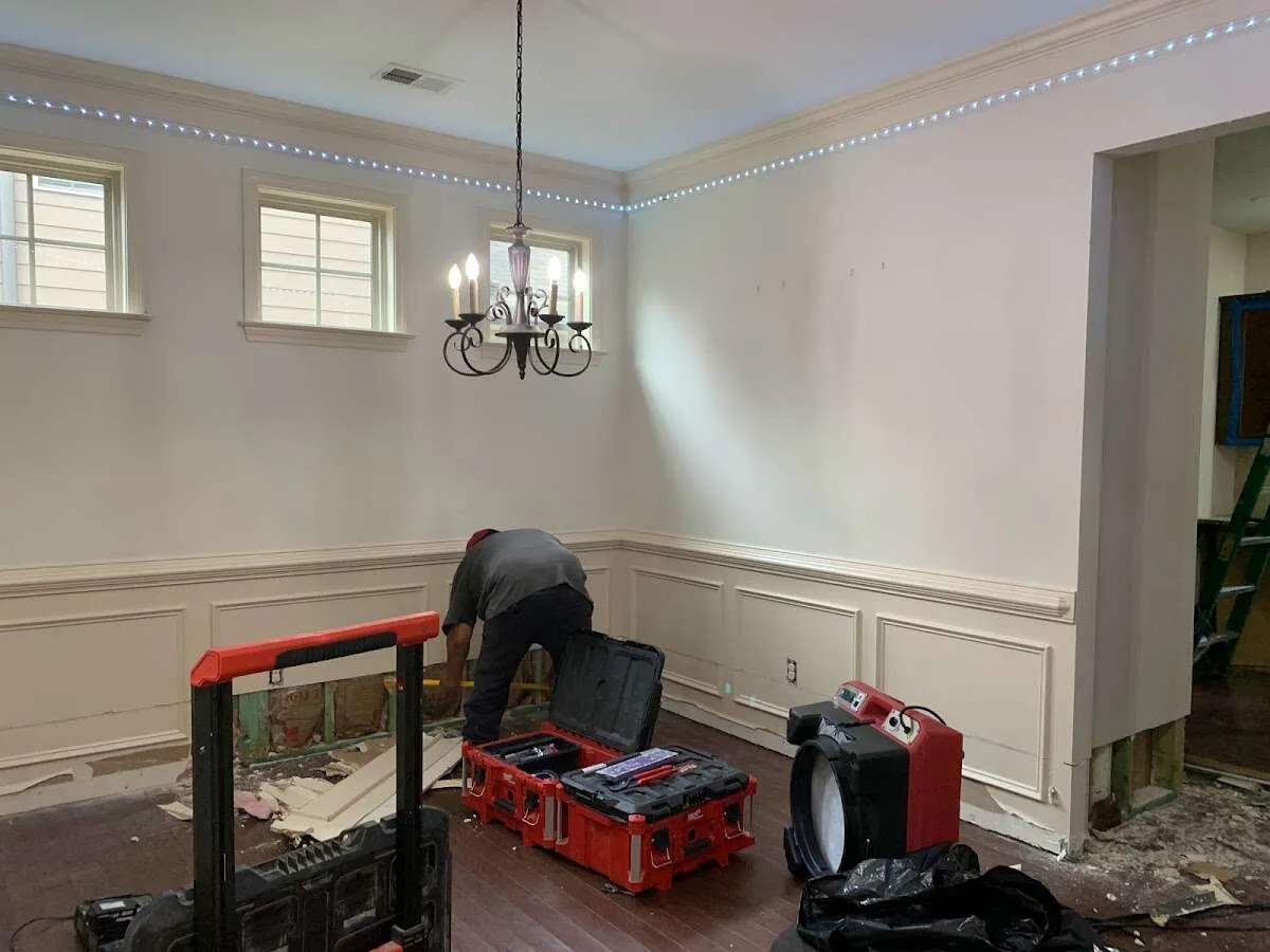 Restoration technician with professional equipment in Wilson